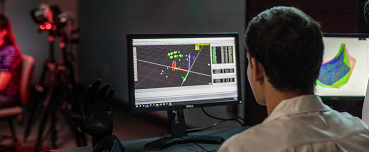 MSU student looking at a computer screen