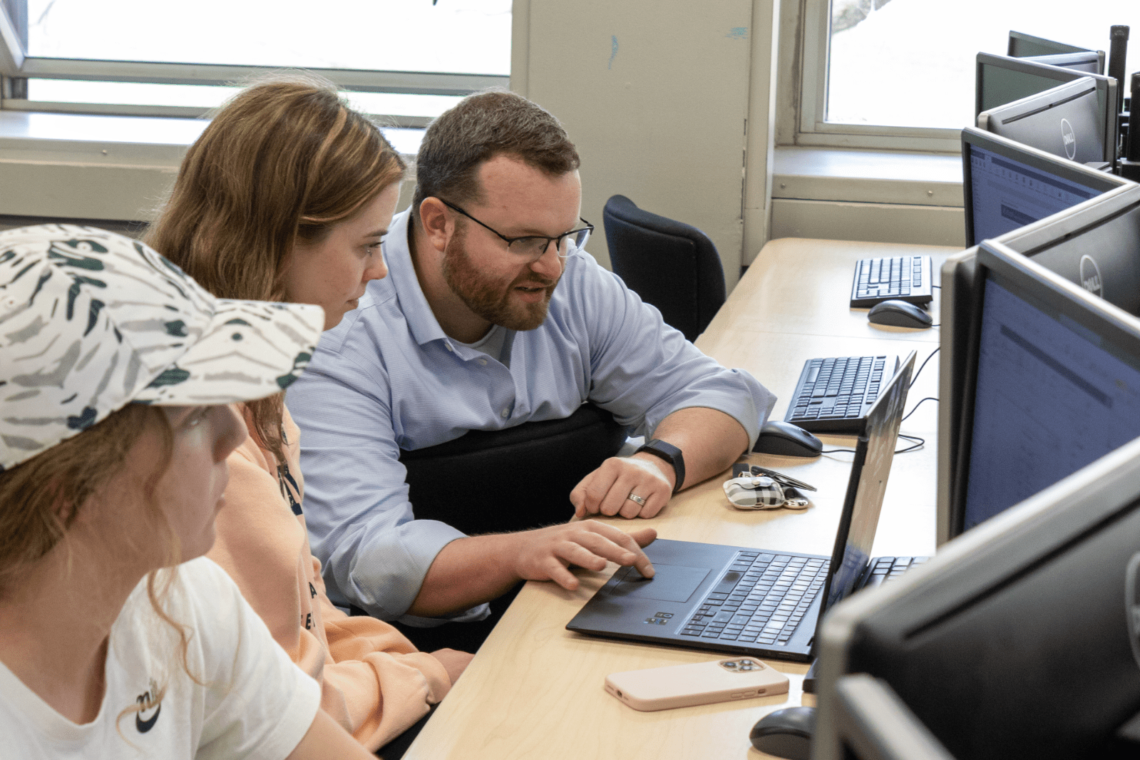 Person instructing students in a computer lab
