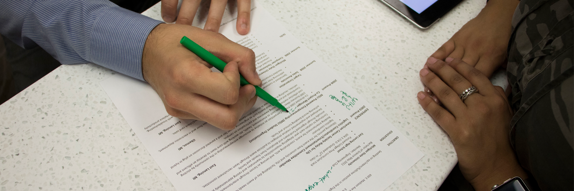 Person writing with pen on paper
