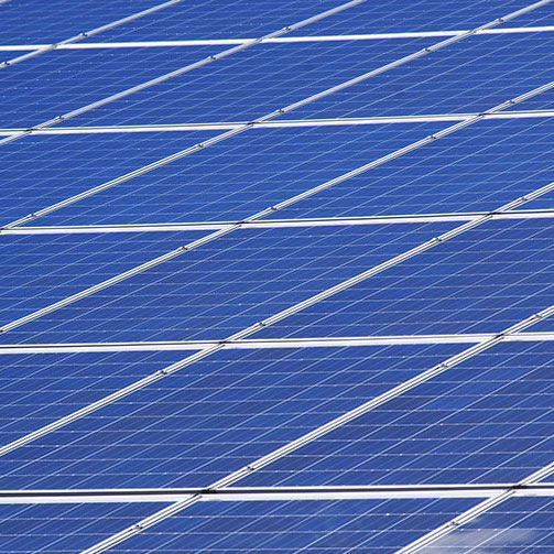 Close-up of solar panels pointed towards the sun