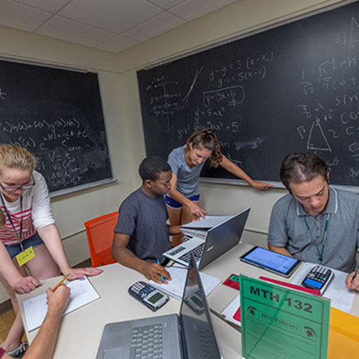 Students studying in classroom