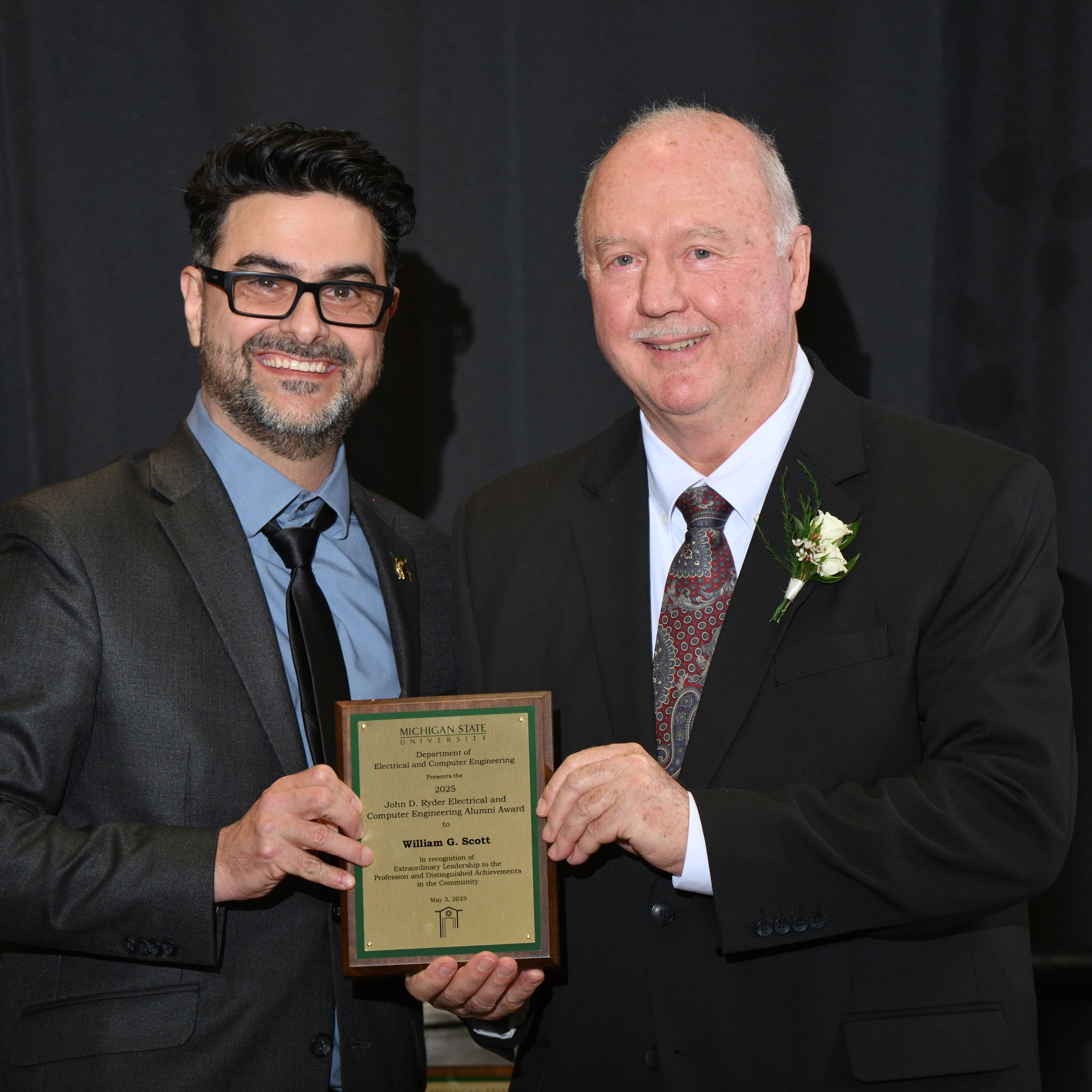 Nelson Sepulveda Alancastro and William G. Scott posing with the award