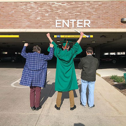 Student and parent celebrating graduation