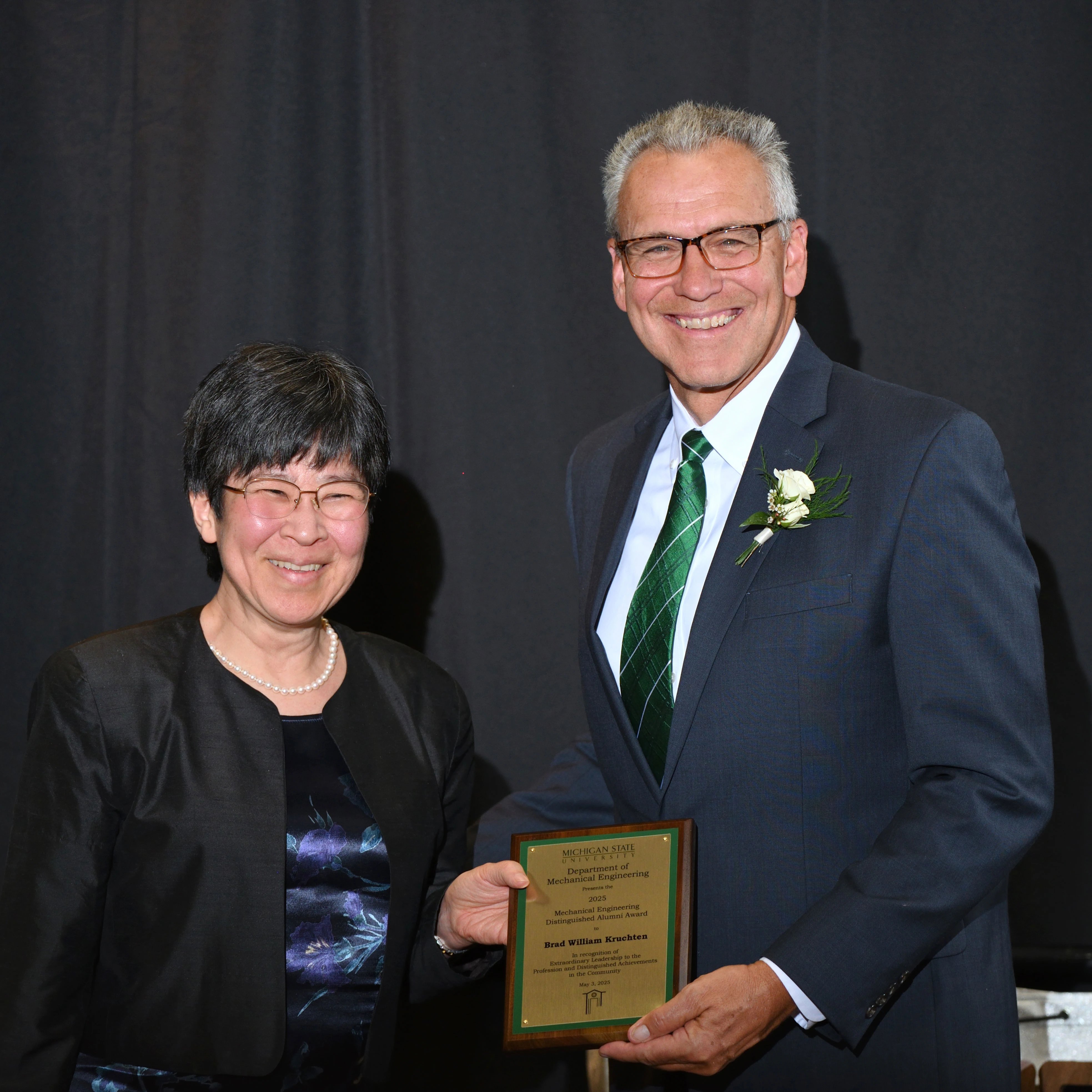Minami Yoda and Brad W. Kruchten posing with the award
