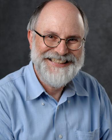 Wolfgang Banzhaf smiling at the camera